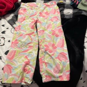 Has flowers, colorful has a zip on the side. It's capris.